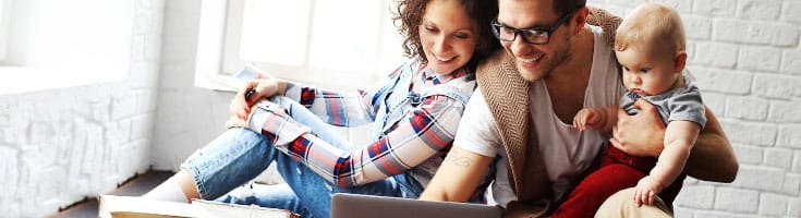 Man applying for mortgage with baby in hand