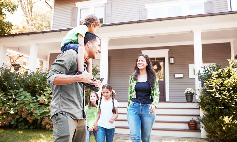 Family leaves house together happily