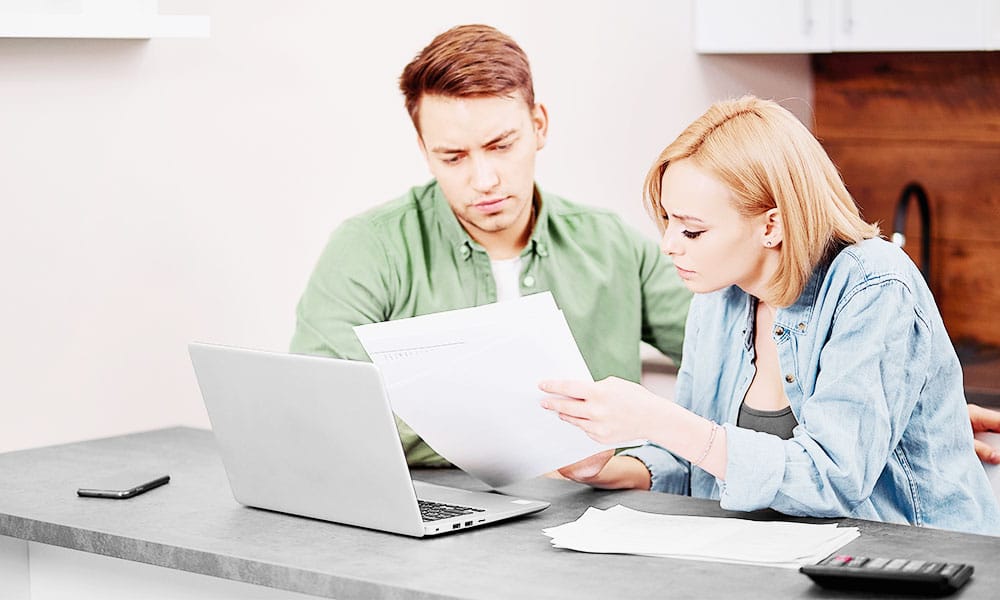 Young couple discusses home equity and mortgage