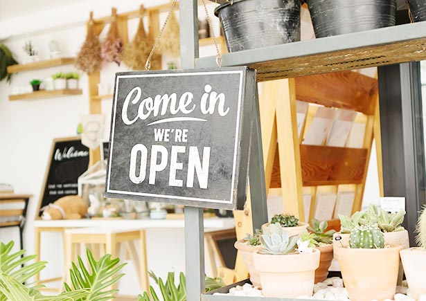 Store with "Come in, We are open" sign