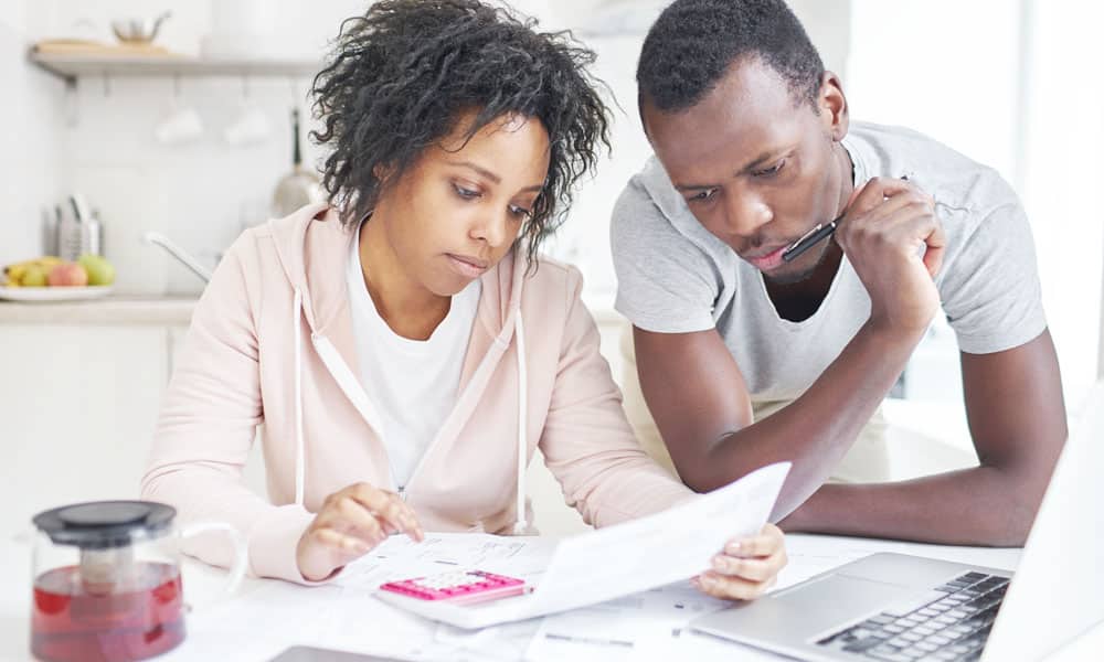 Couple Looking at Papers & Calculations